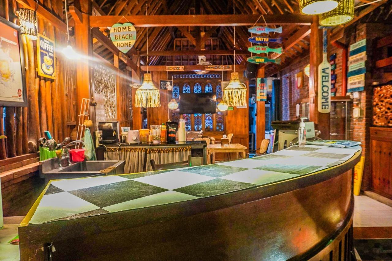 The Wisma Pulau Merah Pasanggaran Bagian luar foto